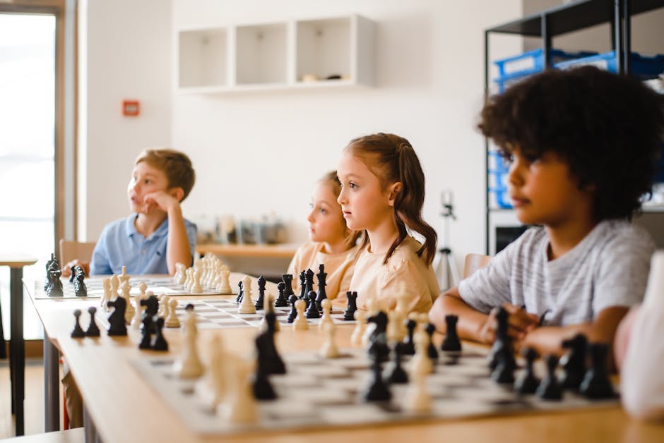 Kids focused on an intense chess game in a classroom, promoting strategic thinking.