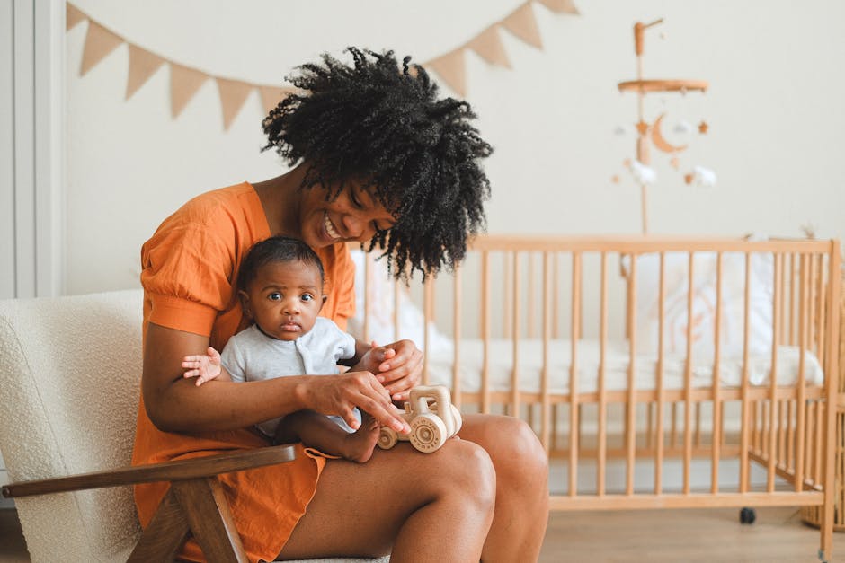 pexels-photo-11369187-11369187 Joyful mother and her baby enjoy playtime in a cozy nursery setting, creating a warm family moment.