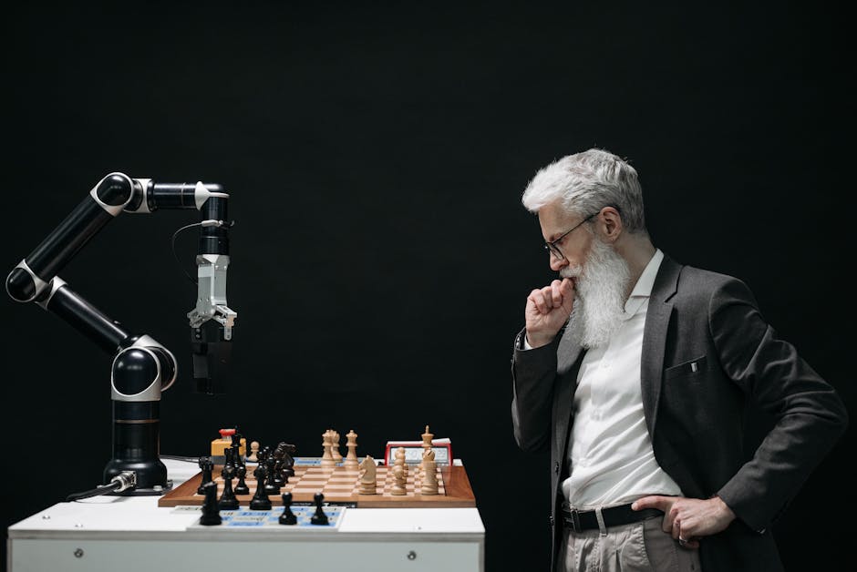 pexels-photo-8438918-8438918 An elderly scientist contemplates a chess move against a robotic arm on a chessboard.